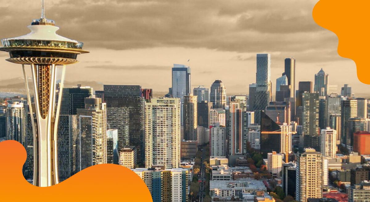 Visit Seattle header image in orange showing downtown Seattle.