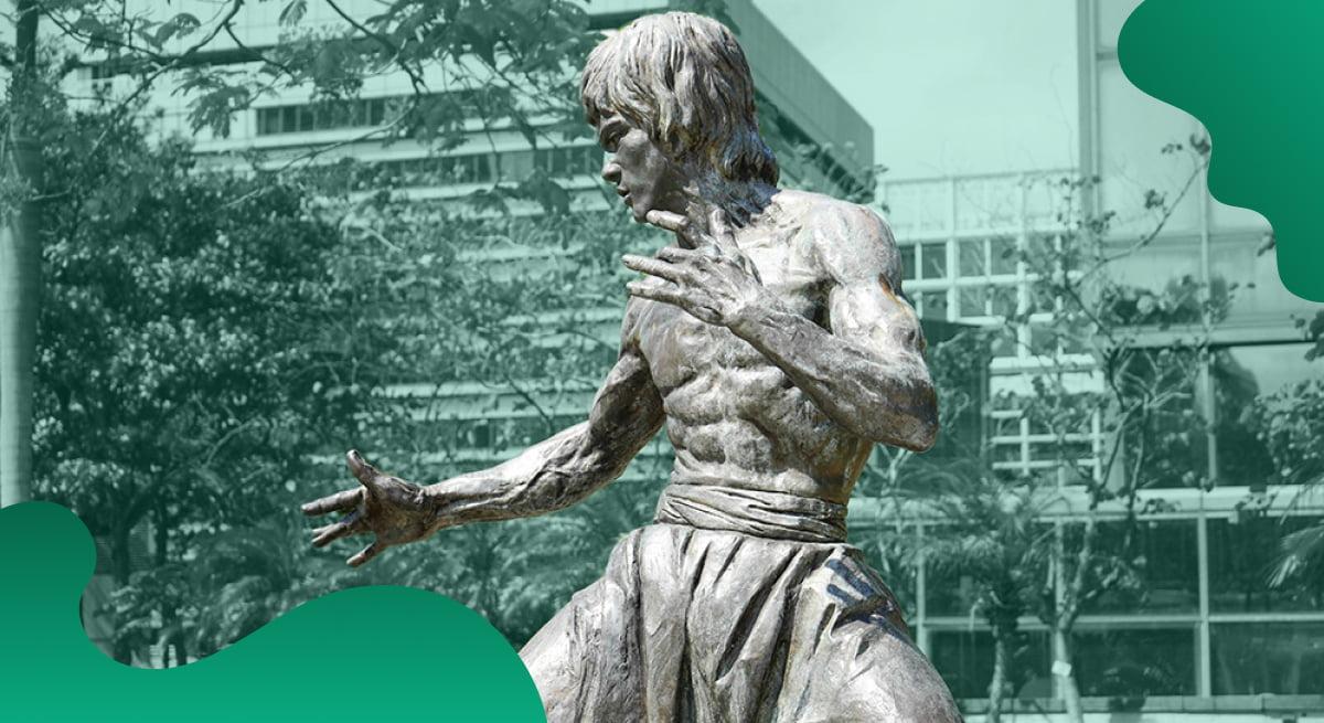 Bruce Lee Enterprises header image in green showing a statue of Bruce Lee in front of a building.