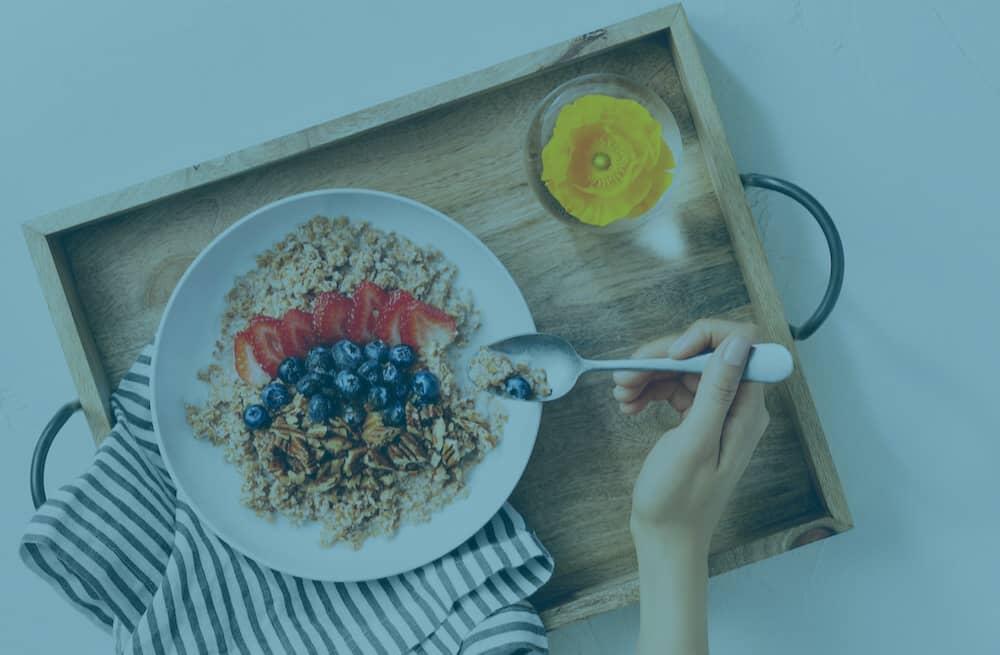 POPSUGAR header image in blue showing a tray loaded with breakfast items.