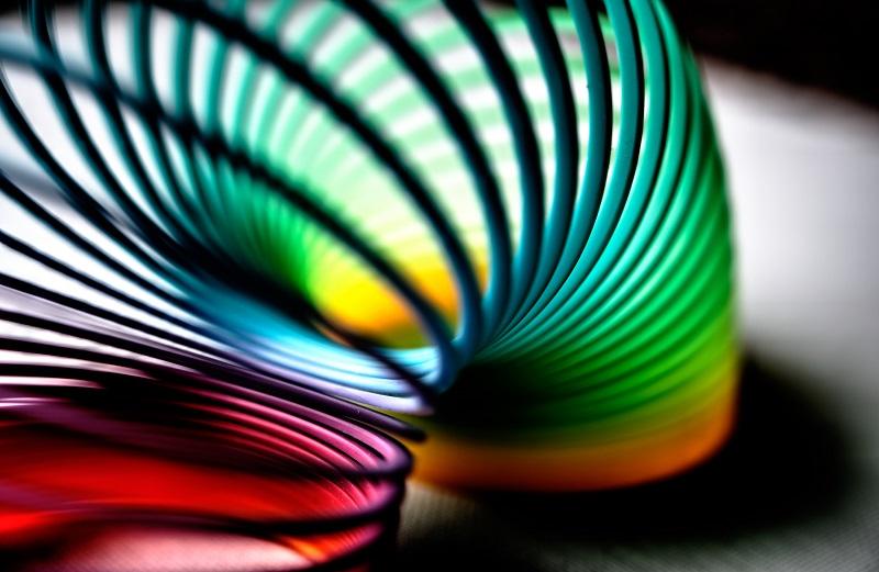 A slinky toy flexing from one spot to the next.