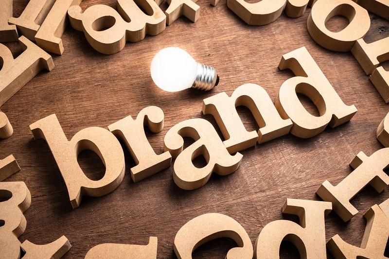 The word 'brand' with wooden pieces.