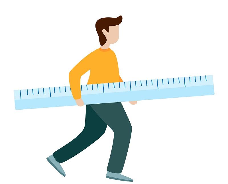 A man holding a giant ruler.