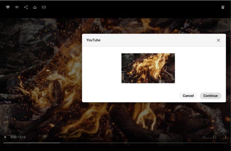 Screenshot of the interface of the Canto DAM showing a video asset with a burning fire in detailed view, overlaid by a dialog box used to share the asset on Youtube.