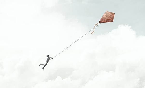 A person losing control of a kite.