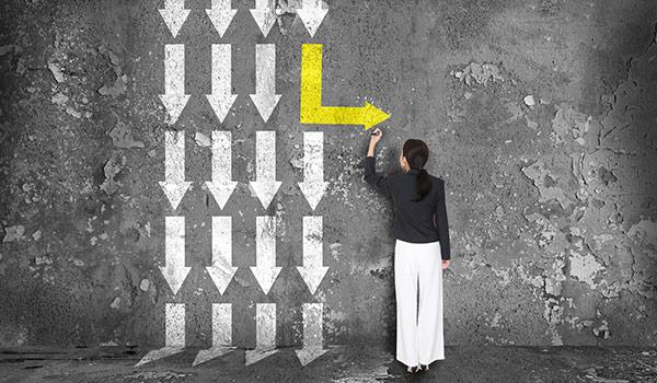 A person drawing a misdirection arrow.