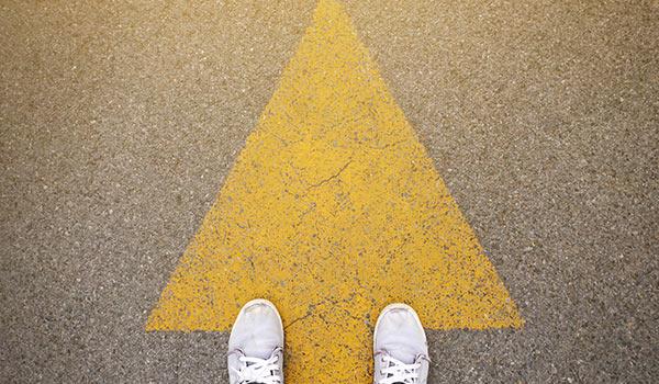 Someone following an arrow on the ground.