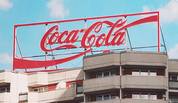 A Coca-Cola sign on a building.