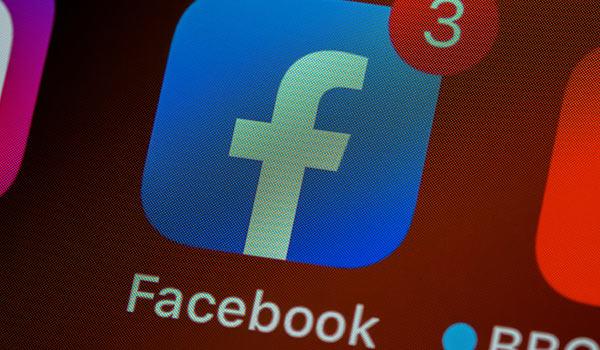 The Facebook logo on a smartphone.
