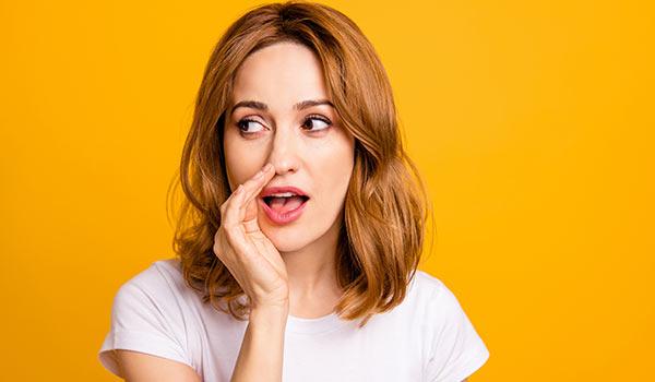 A woman telling a secret.