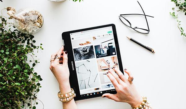 Someone using a tablet to look at images.