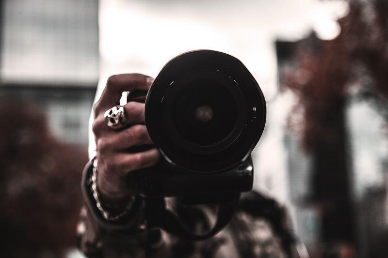 A man holding a camera.