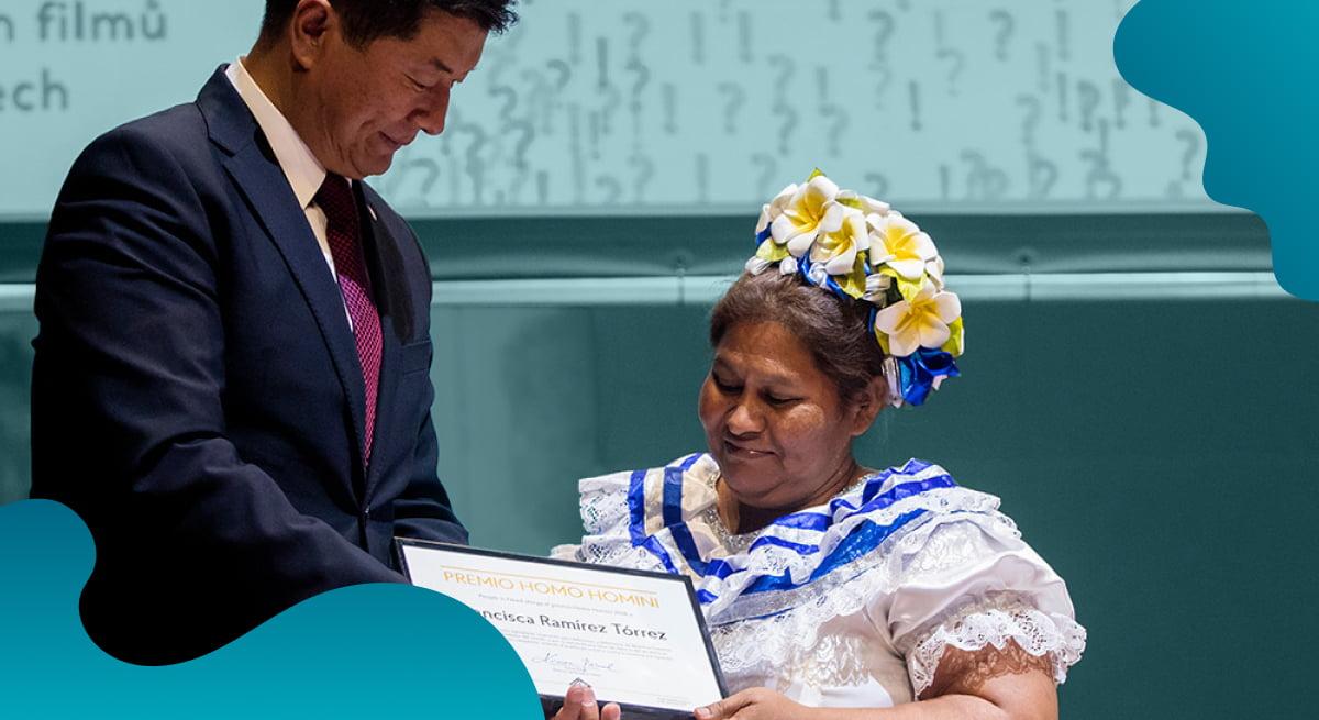 People in Need header image in blue showing woman graduating.