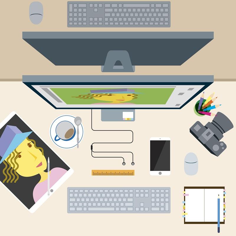 A computer with a camera and photo next to it.