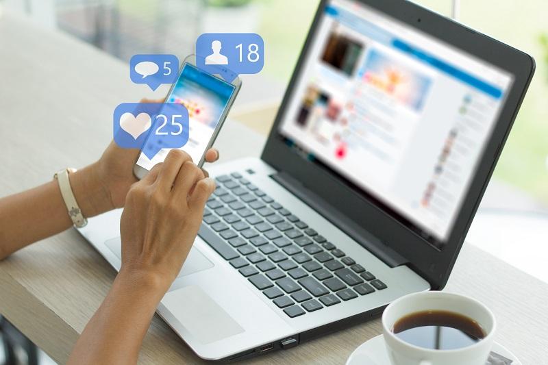 A person uses social media on a smartphone.