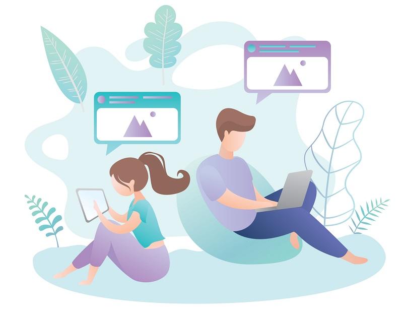 Two young people on laptops.