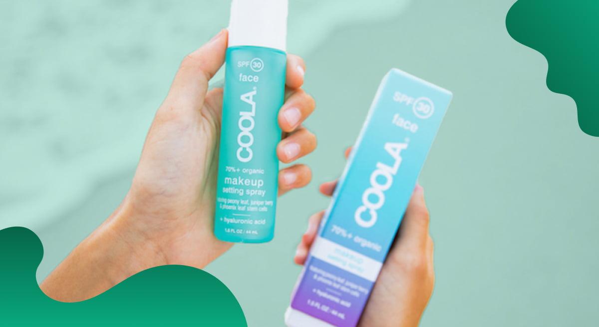 COOLA Suncare header image in green showing someone holding suncare products on a beach.