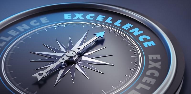 A compass with 'excellence' as a bearing.
