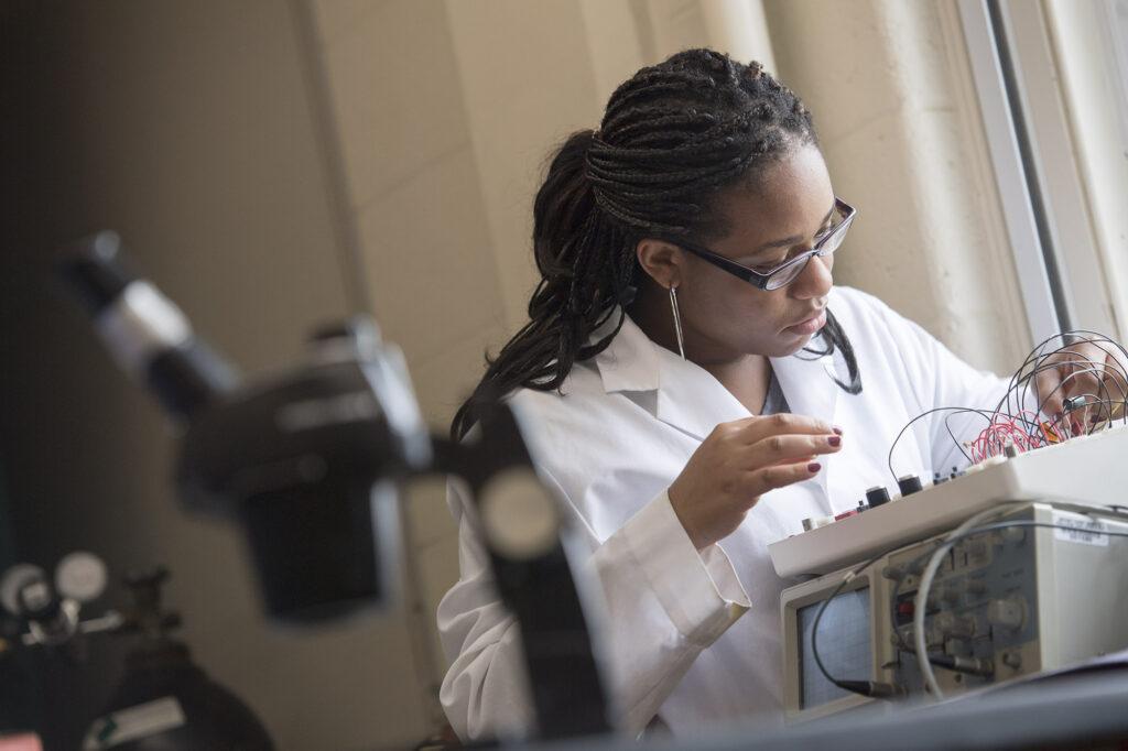 A woman using technical equipment.