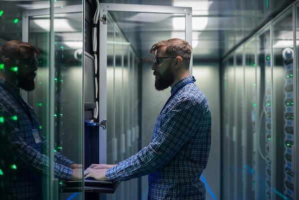 man in front of data storage unit