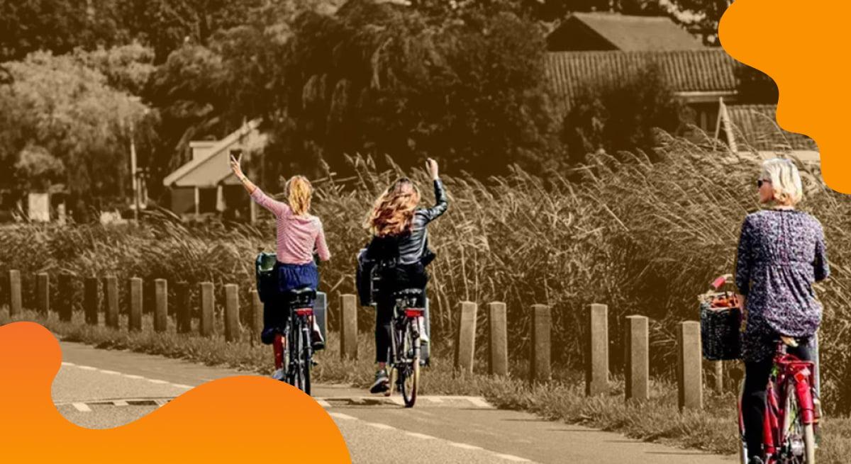 amsterdam&partners header image in orange of people enjoying bike rides on dedicated paths.