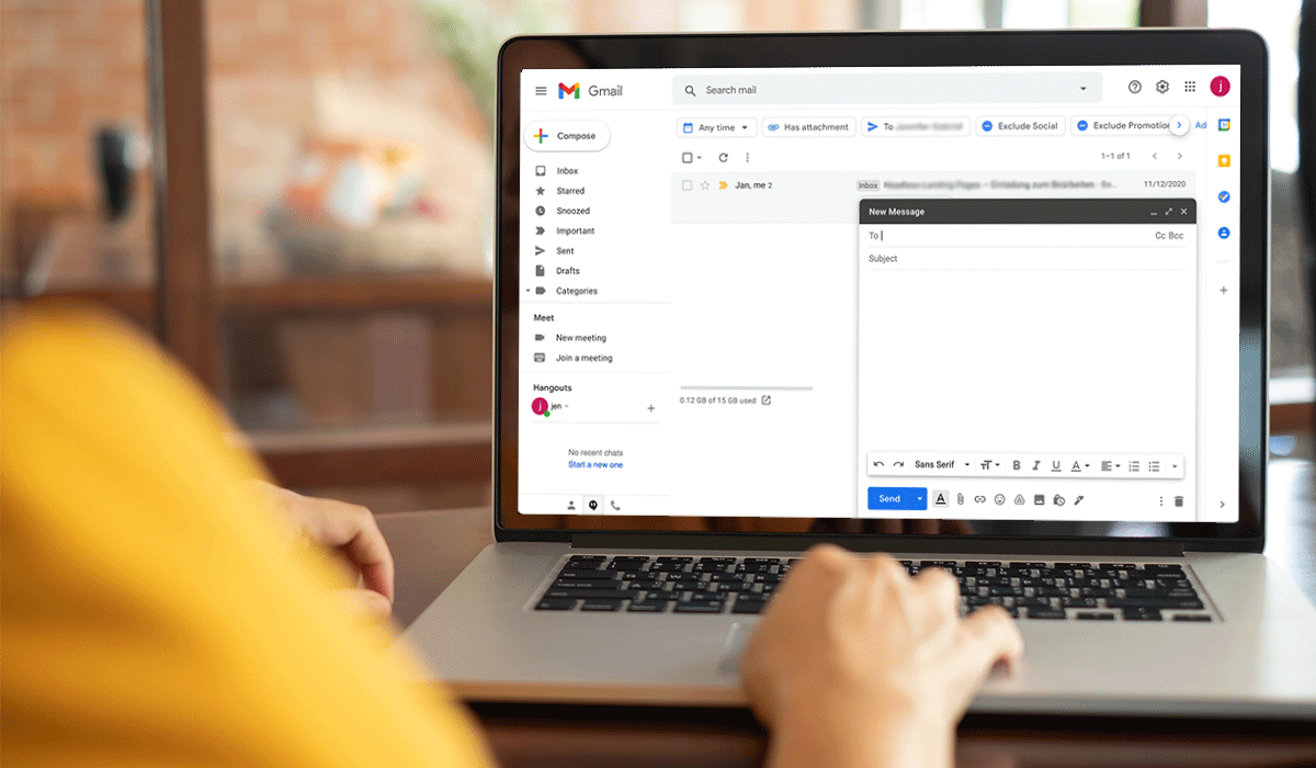Gmail inbox and open draft on a laptop computer.