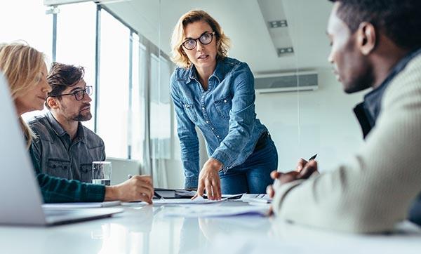 Creative director in leads a meeting.