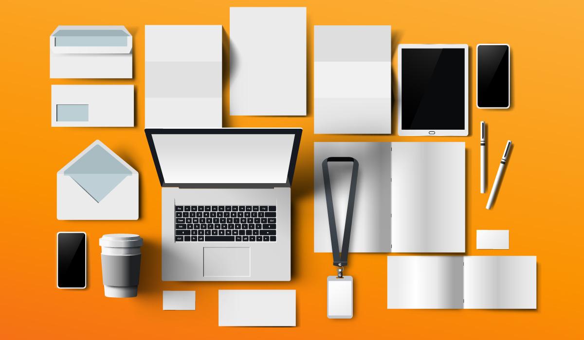 Blank examples of print and digital marketing collateral on an orange background.
