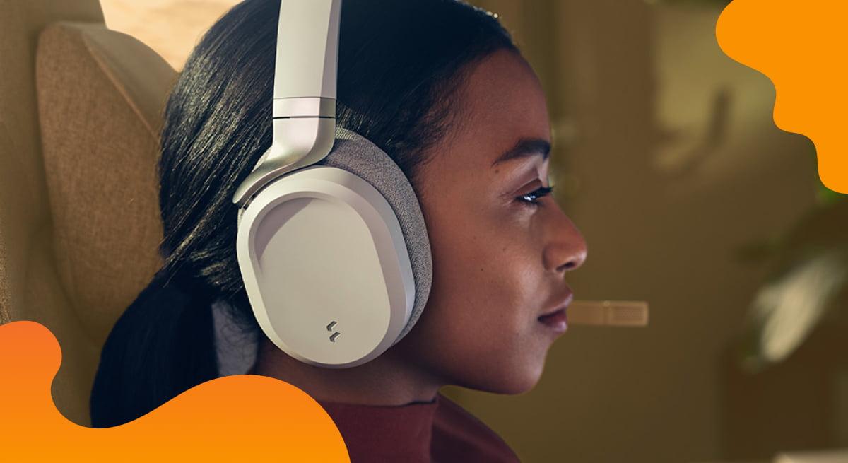Fractal Design header image in orange of a woman wearing over the ear headphones.