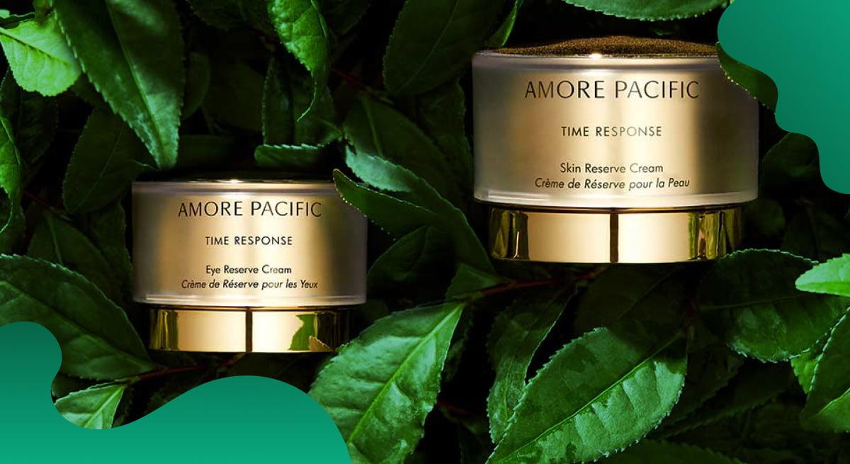 Amorepacific header image in green of products against natural background.