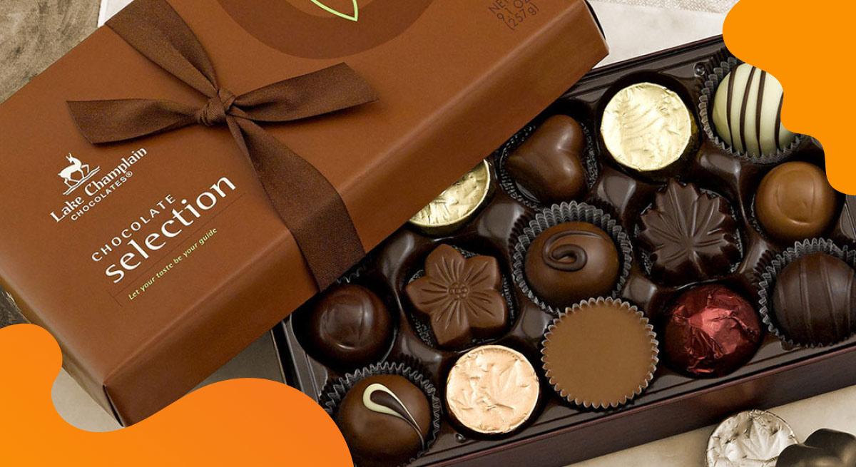 Lake Champlain Chocolates header image in orange of chocolate selection