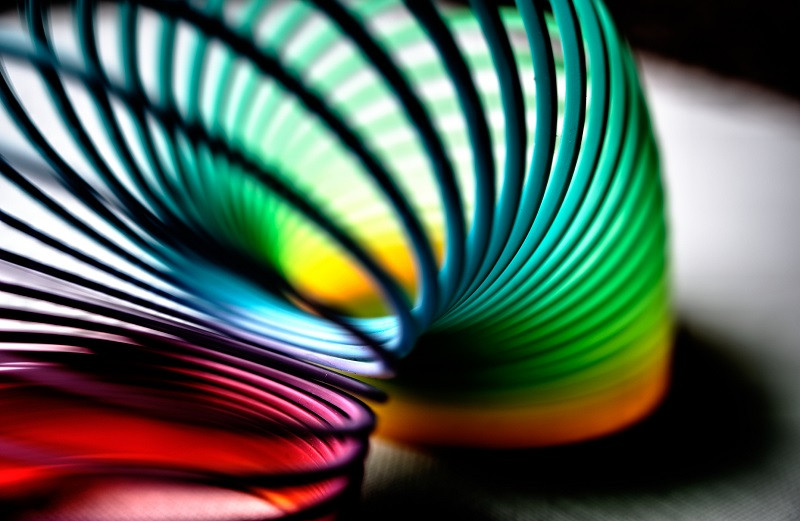 A slinky toy flexing from one spot to the next.