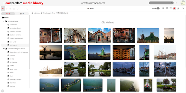 I Am Amsterdam's media library filled with images of water and interesting architecture with the folder view.