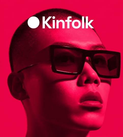 Kinfolk campaign portrait in black sunglasses on red